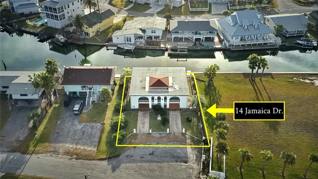 an aerial view of a city with ocean view