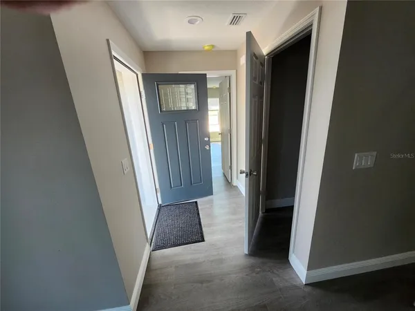 an entryway with a white walls