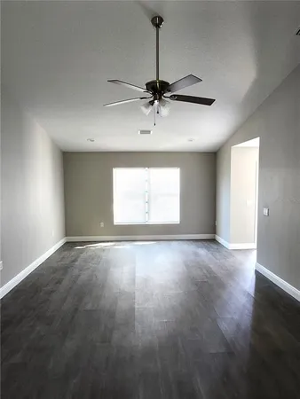 a view of an empty room with a window