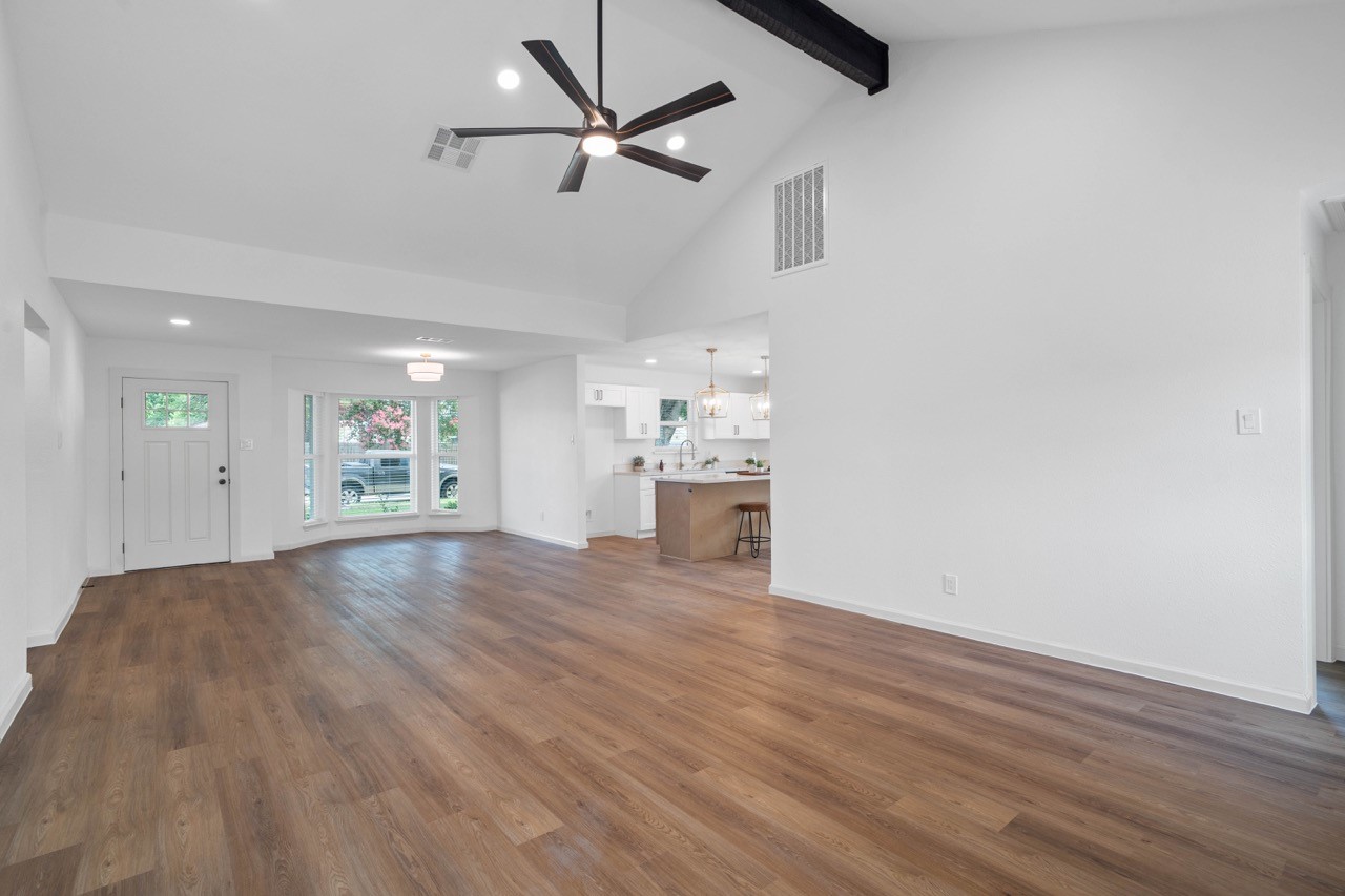 5326 Findlay Drive Pasadena, TX 77505 - Photo 15 of 50 Spacious open-concept living area with soaring vaulted ceilings, exposed beam, recessed lighting, and seamless flow into the beautifully updated kitchen.