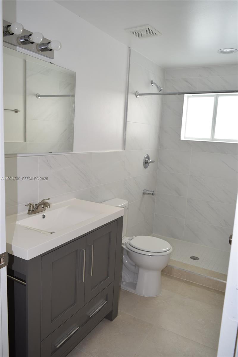 435 Southwest 78th Court Miami, FL 33144 - Photo 16 of 19 a bathroom with a sink toilet and vanity