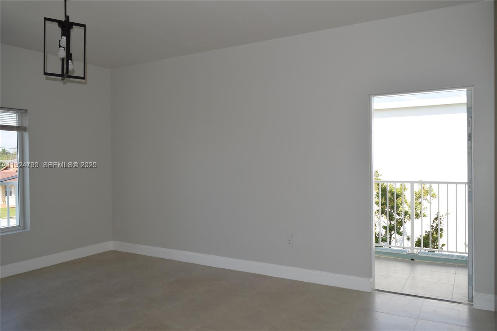 435 Southwest 78th Court Miami, FL 33144 - Photo 4 of 19 an empty room with windows