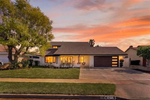 front view of a house next to a yard