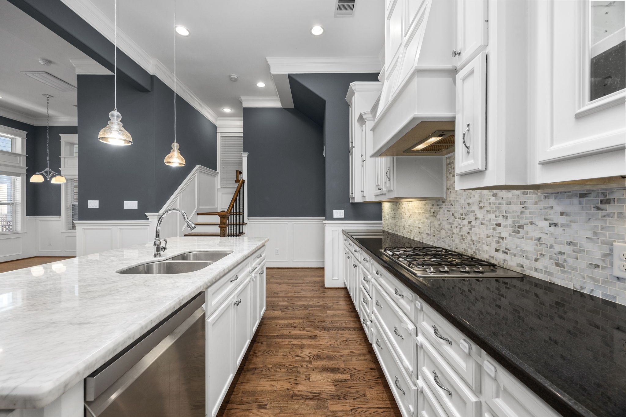 619 Rutland Street, Unit B Houston, TX 77007 - Photo 12 of 33 a kitchen with granite countertop a sink and a stove
