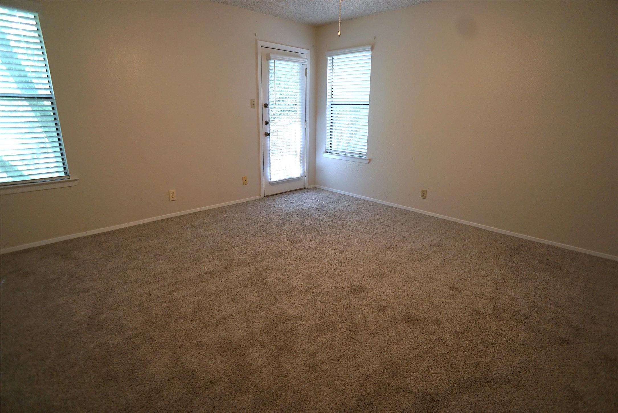 8418 Fathom Circle, Unit C302 Austin, TX 78750 - Photo 7 of 9 an empty room with windows