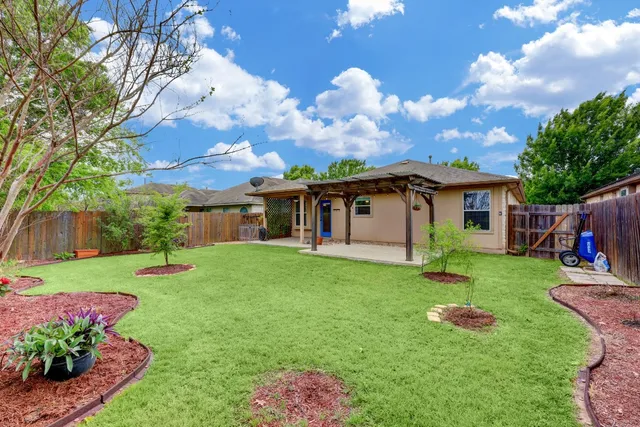 a front view of a house with a garden and porch