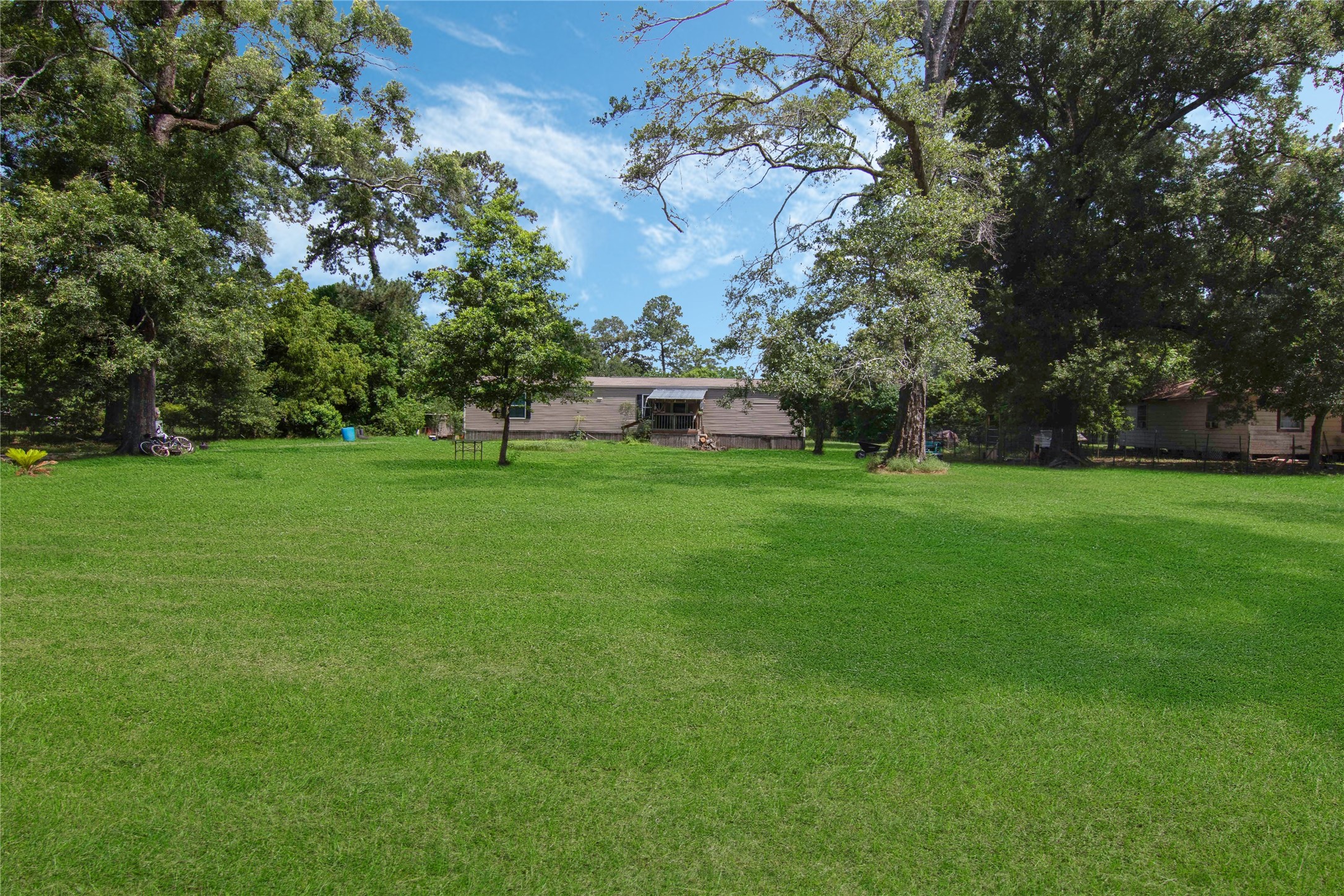 18093 Pickering Road Conroe, TX 77302 - Photo 5 of 29 a view of a big yard with swimming pool