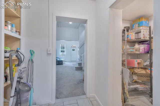 a kitchen with granite countertop a sink and cabinets