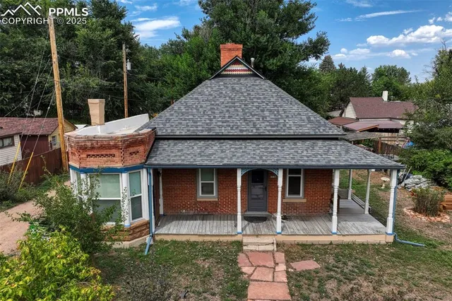 a view of a park with large trees
