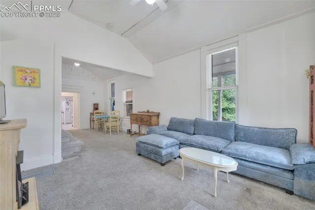 a living room with furniture and a couch