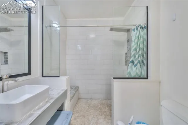 a bathroom with a bathtub and a sink