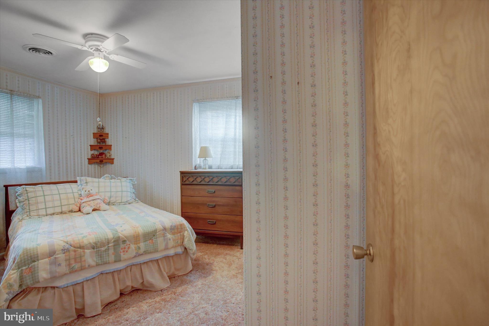 10839 Old Forge Road Waynesboro, PA 17268 - Photo 19 of 48 a bedroom with a bed and a chandelier