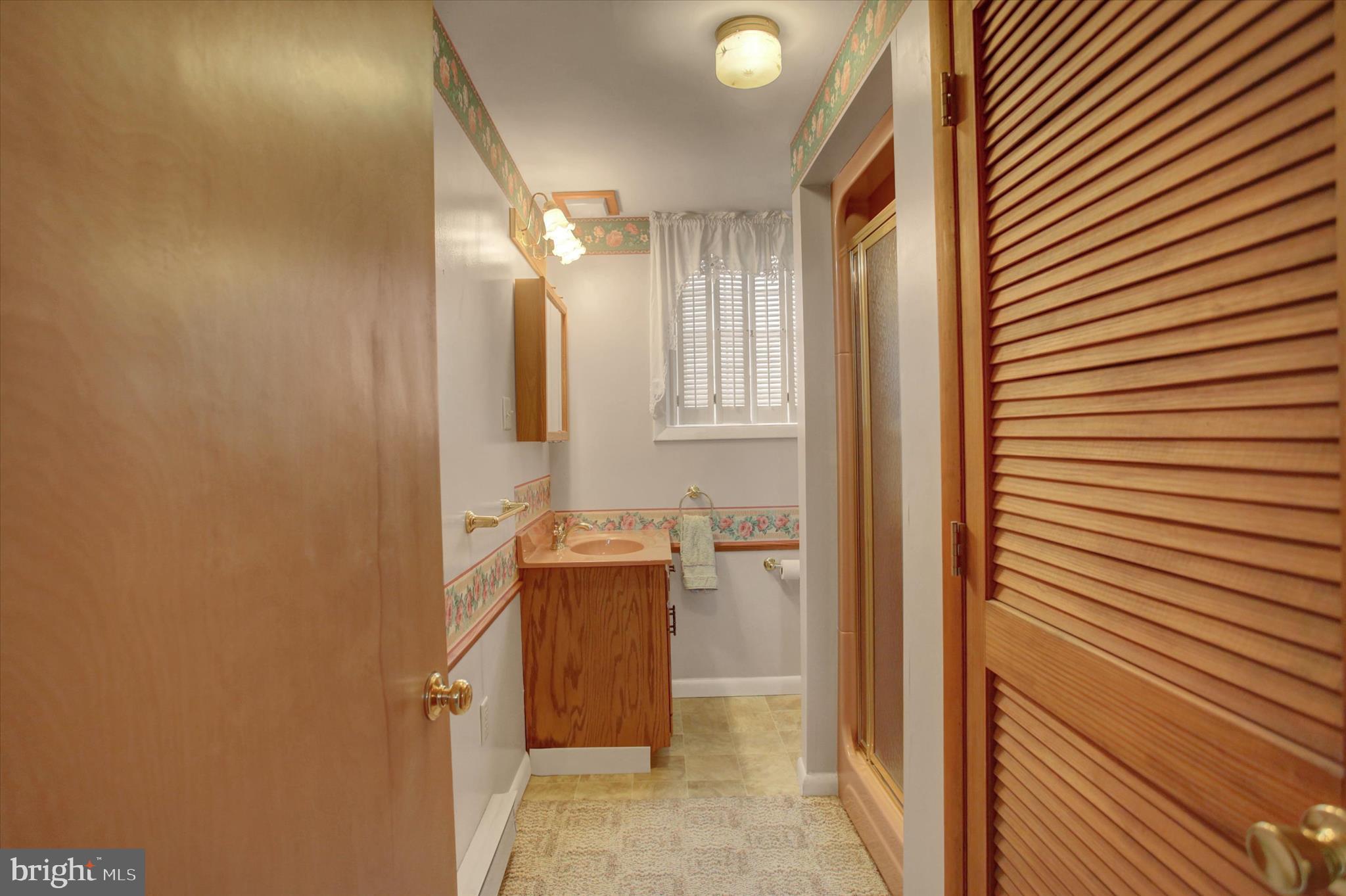10839 Old Forge Road Waynesboro, PA 17268 - Photo 26 of 48 a bathroom with a granite countertop sink and a mirror
