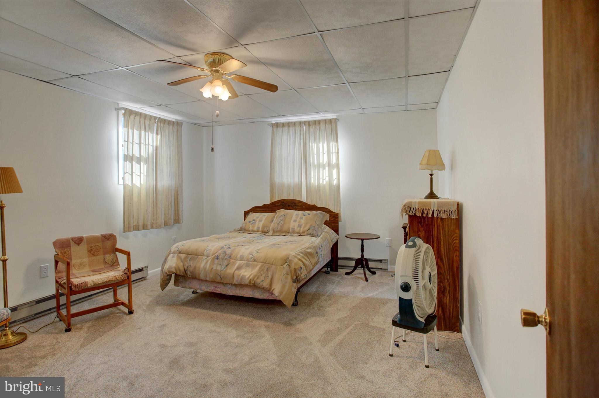 10839 Old Forge Road Waynesboro, PA 17268 - Photo 28 of 48 a bedroom with a bed and a chandelier