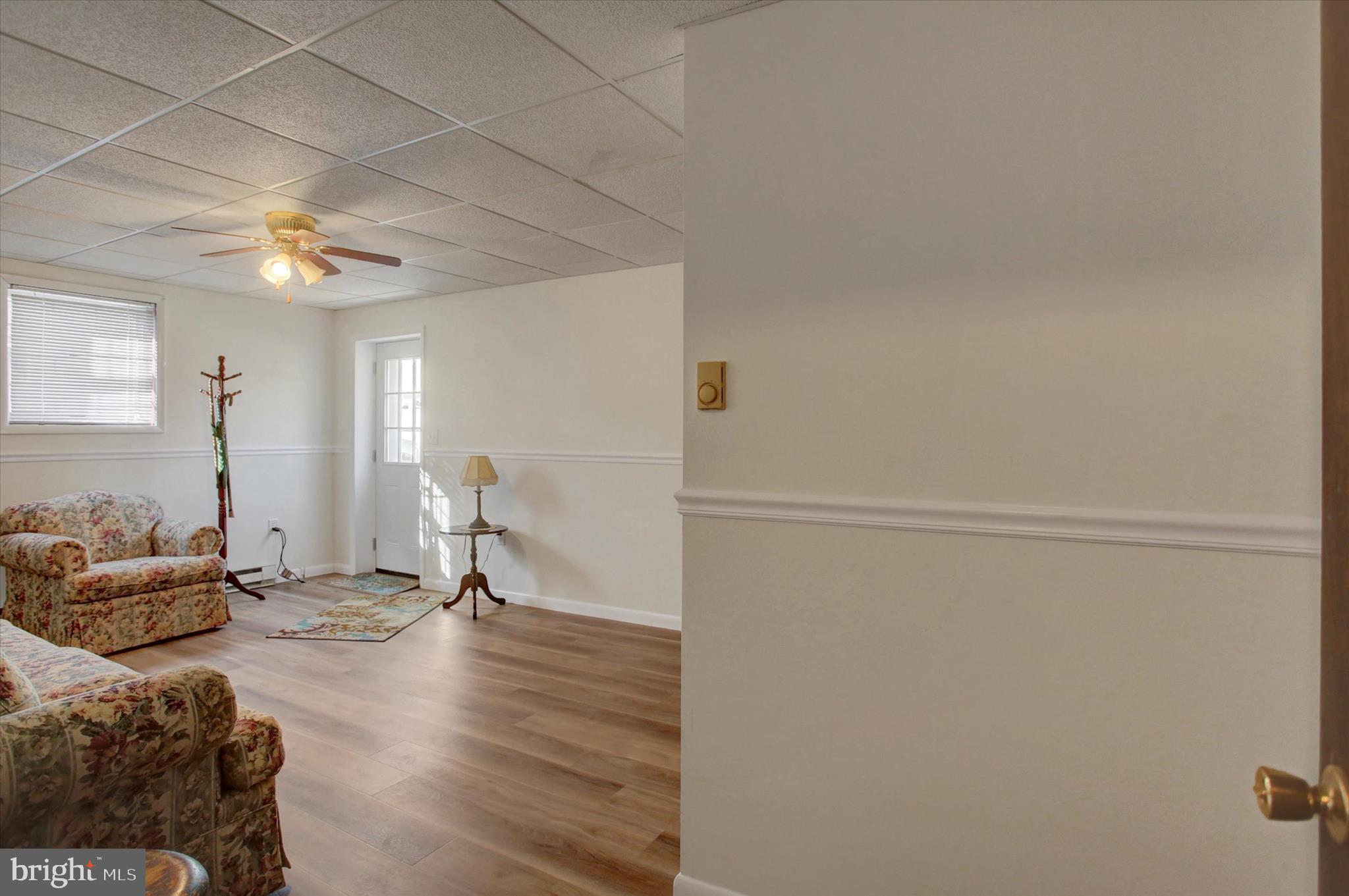 10839 Old Forge Road Waynesboro, PA 17268 - Photo 30 of 48 a living room with furniture and a chandelier