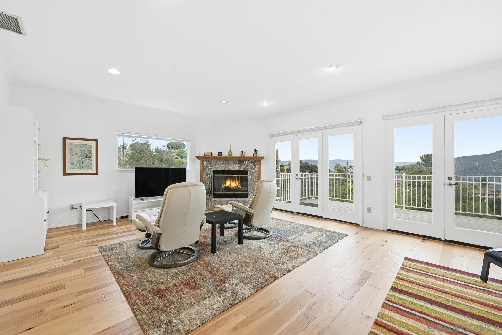 3132 Don Rolando Escondido, CA 92025 - Photo 12 of 34 a living room with furniture a rug wooden floor and windows