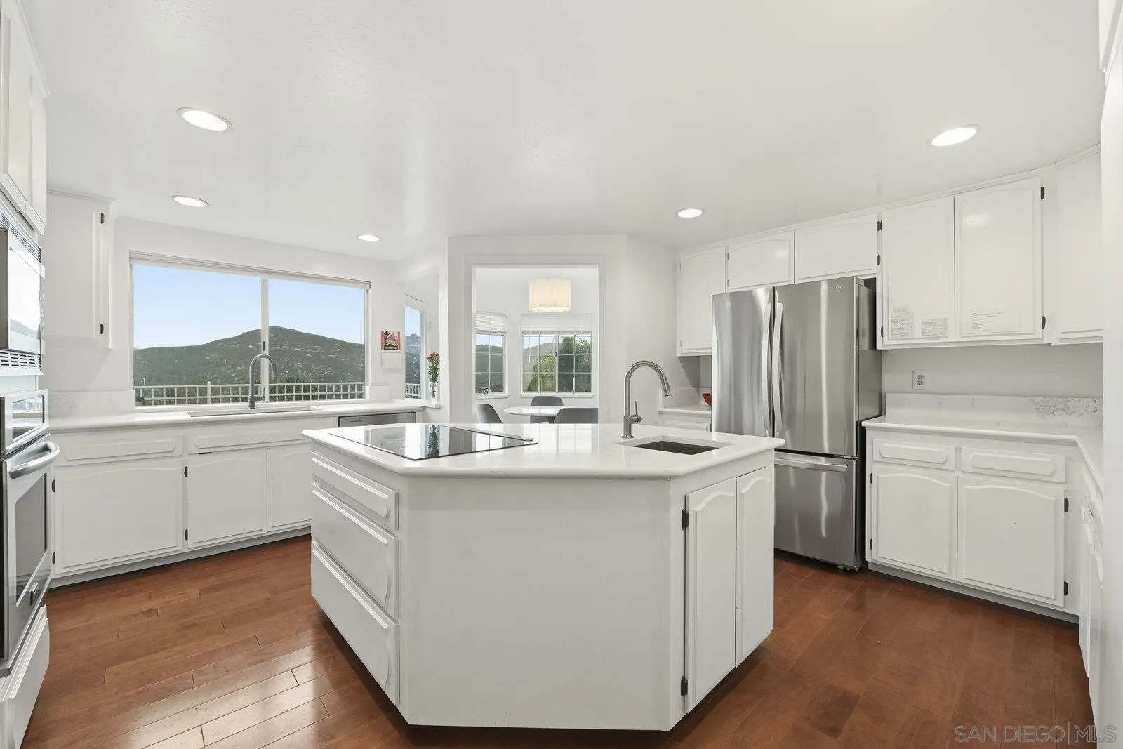 3132 Don Rolando Escondido, CA 92025 - Photo 17 of 47 a kitchen with white cabinets and white appliances