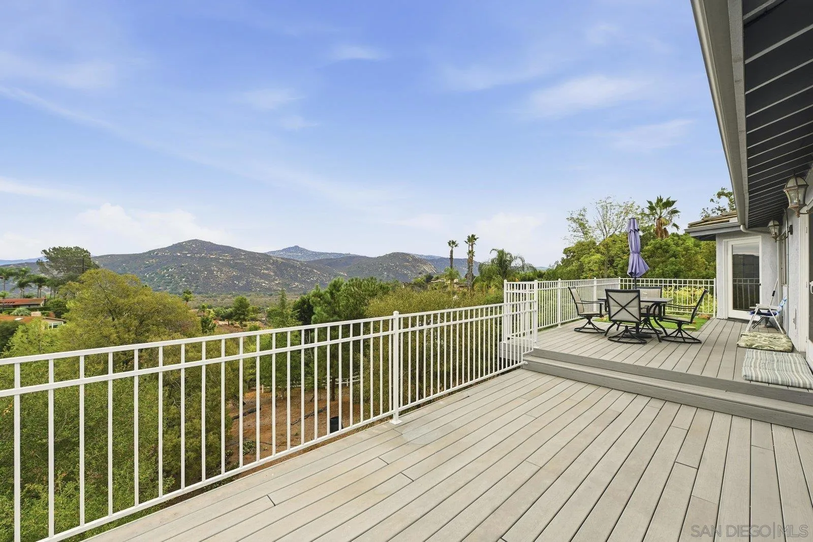3132 Don Rolando Escondido, CA 92025 - Photo 2 of 34 a view of a balcony with wooden floor and iron fence