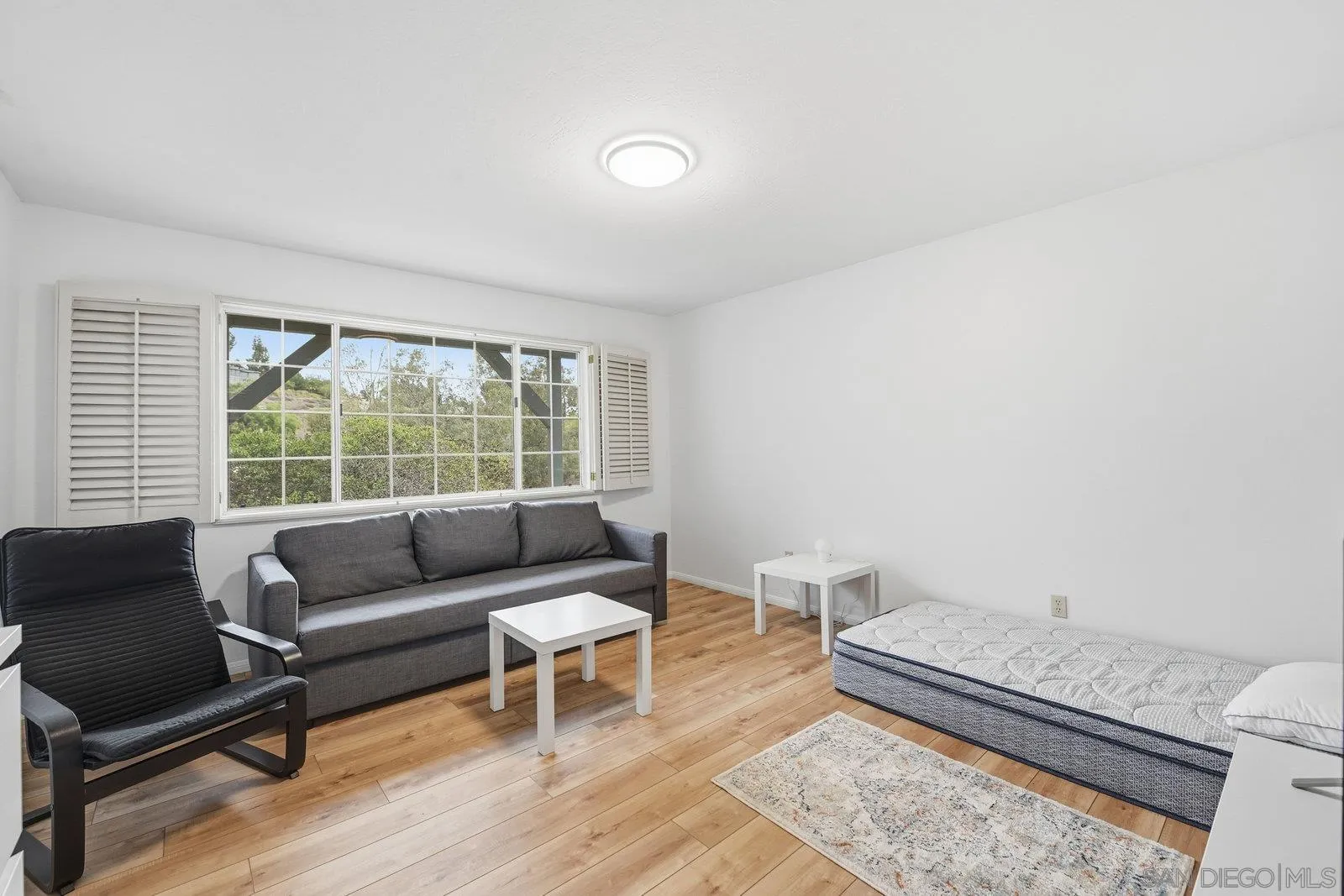 3132 Don Rolando Escondido, CA 92025 - Photo 30 of 47 a living room with furniture and a large window