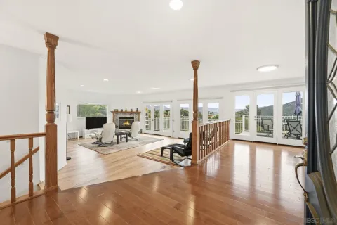 a view of a living room and a floor to ceiling window