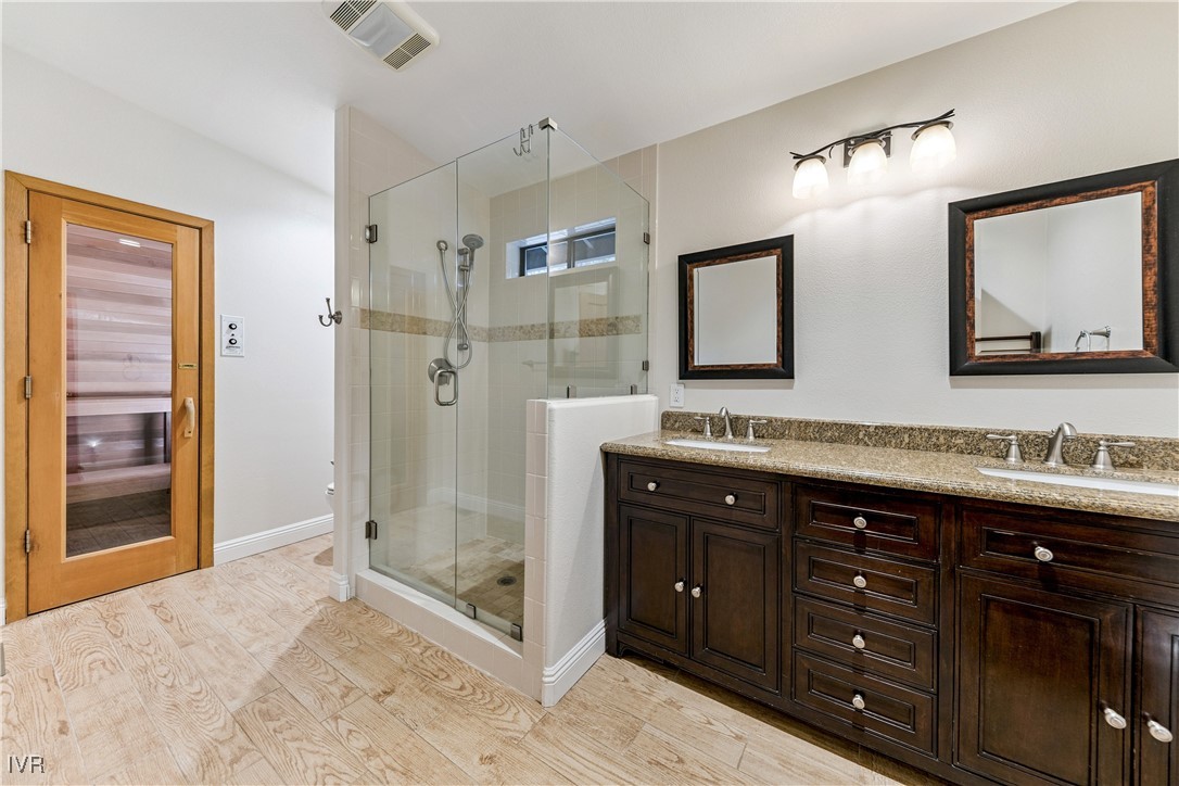 771 Randall Avenue Incline Village, NV 89451 - Photo 18 of 44 a bathroom with a sink double vanity and a shower