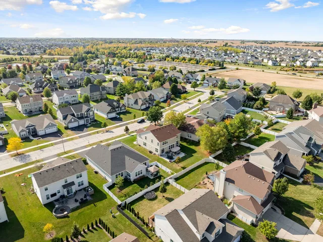 an aerial view of residential houses with outdoor space