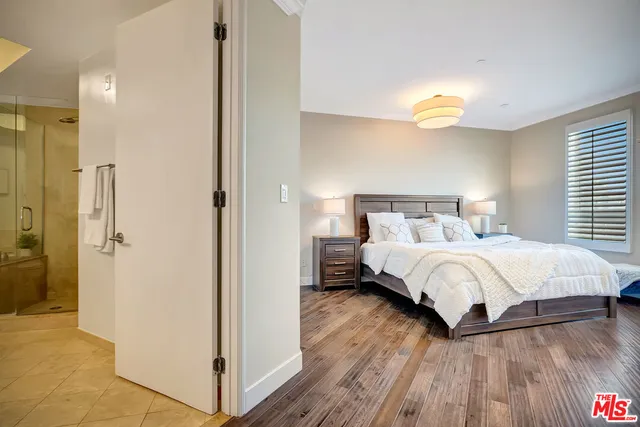 a bedroom with a bed and a fireplace