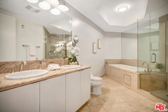 a bathroom with a tub and shower