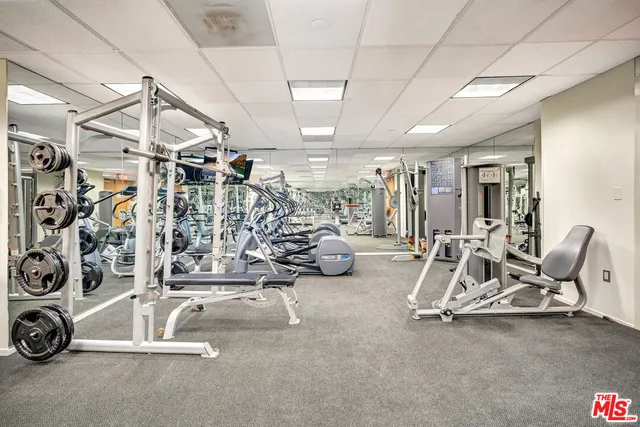 a view of a hallway with bathroom and a bathroom