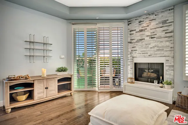 a living room with furniture and fireplace