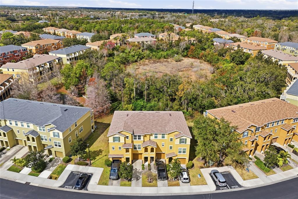 an aerial view of residential houses with outdoor space