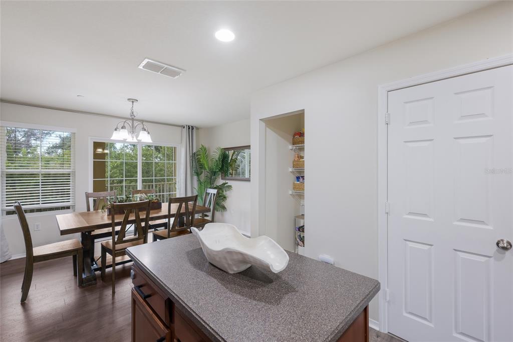 8907 White Sage Loop Lakewood Ranch, FL 34202 - Photo 11 of 33 a living room with furniture and a table