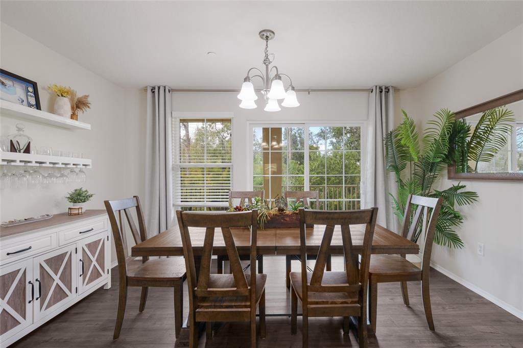 8907 White Sage Loop Lakewood Ranch, FL 34202 - Photo 12 of 33 a view of a dining room with furniture window and outside view