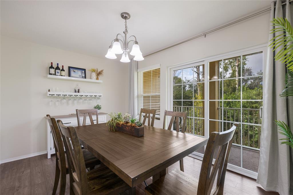 8907 White Sage Loop Lakewood Ranch, FL 34202 - Photo 13 of 33 a view of a dining room with furniture window and outside view