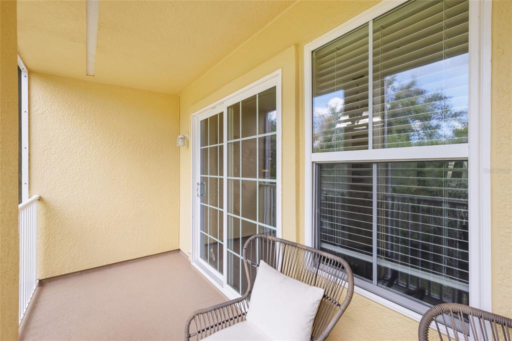 8907 White Sage Loop Lakewood Ranch, FL 34202 - Photo 14 of 33 a view of balcony and wooden floor