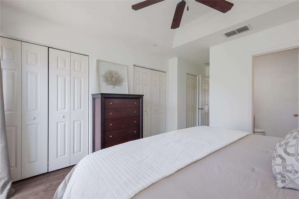 8907 White Sage Loop Lakewood Ranch, FL 34202 - Photo 18 of 33 a bedroom with a bed and a dresser