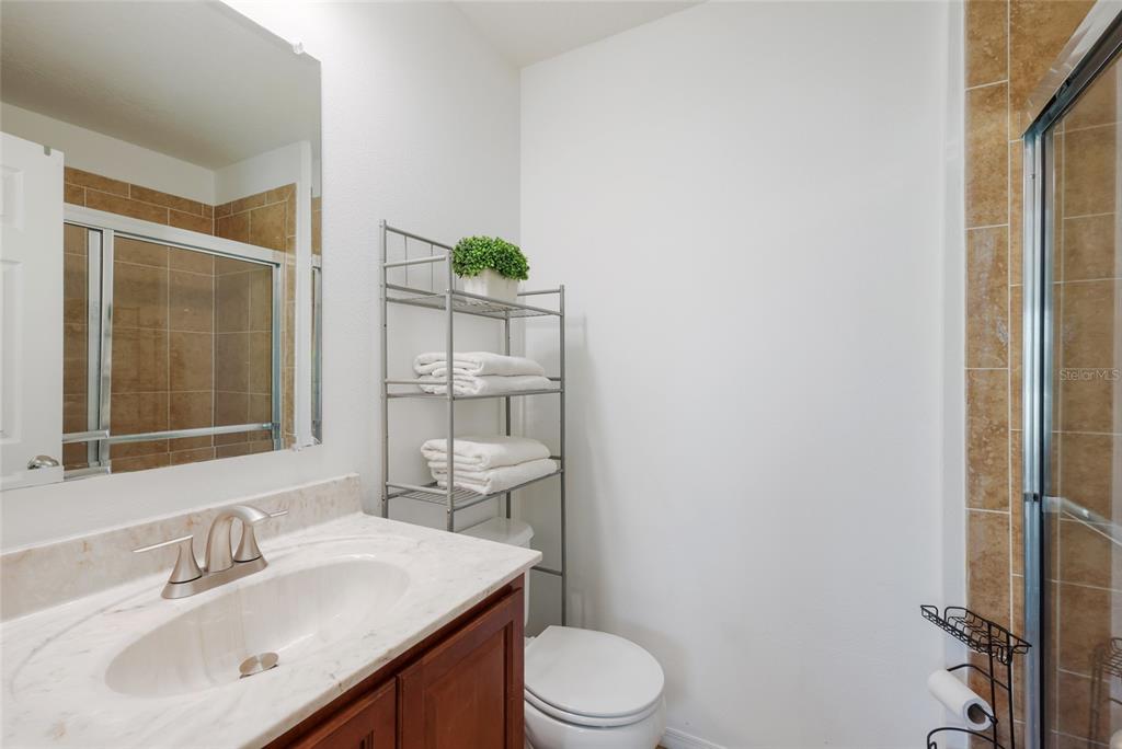 8907 White Sage Loop Lakewood Ranch, FL 34202 - Photo 19 of 33 a bathroom with a sink a toilet and shower