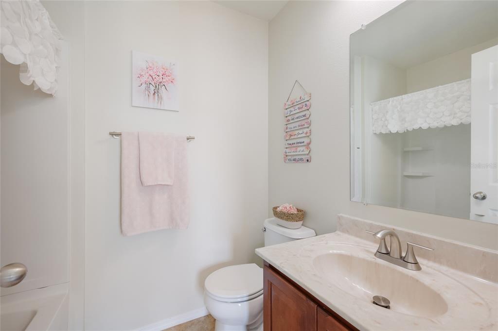 8907 White Sage Loop Lakewood Ranch, FL 34202 - Photo 24 of 33 a bathroom with a sink and a toilet
