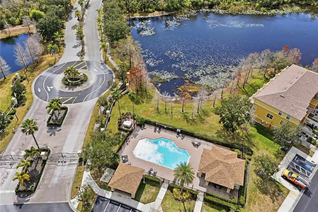 8907 White Sage Loop Lakewood Ranch, FL 34202 - Photo 32 of 33 an aerial view of a house with a yard and lake view