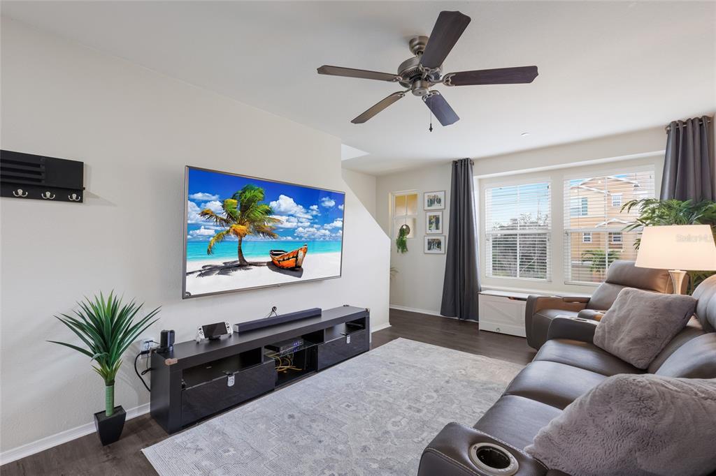 8907 White Sage Loop Lakewood Ranch, FL 34202 - Photo 5 of 33 a living room with furniture and a flat screen tv