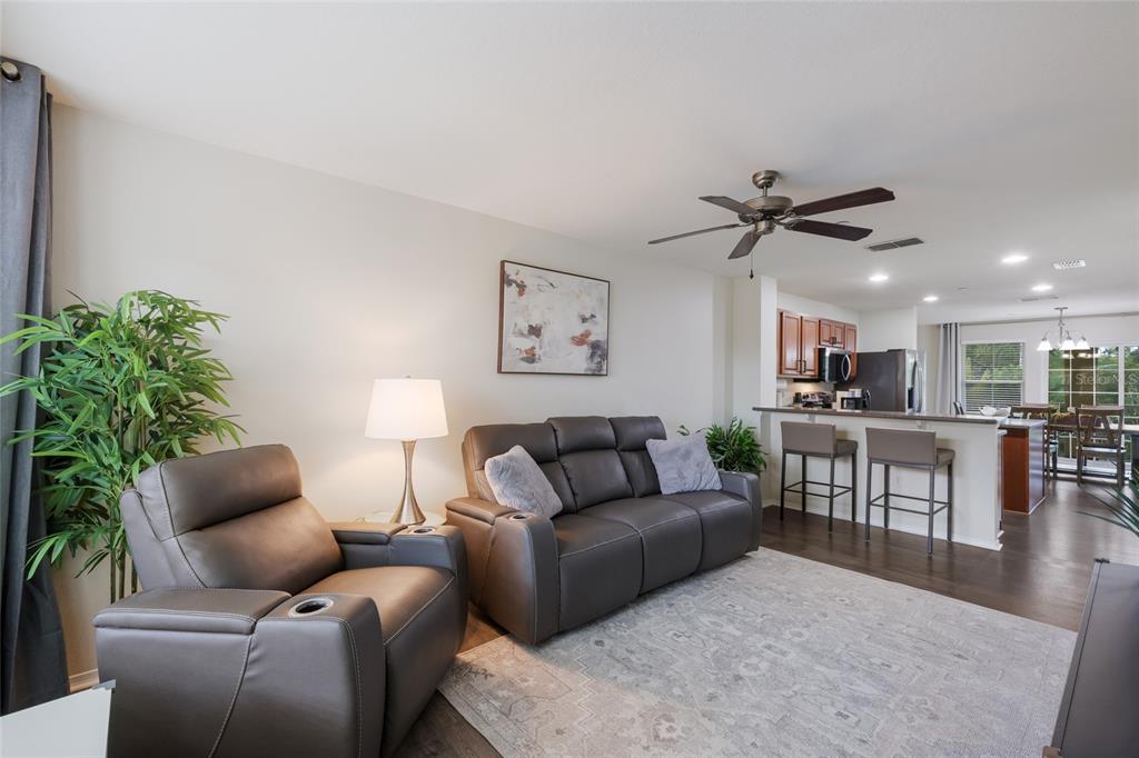 8907 White Sage Loop Lakewood Ranch, FL 34202 - Photo 6 of 33 a living room with furniture kitchen and a table