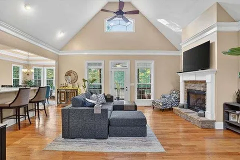 a living room with fireplace furniture and a flat screen tv