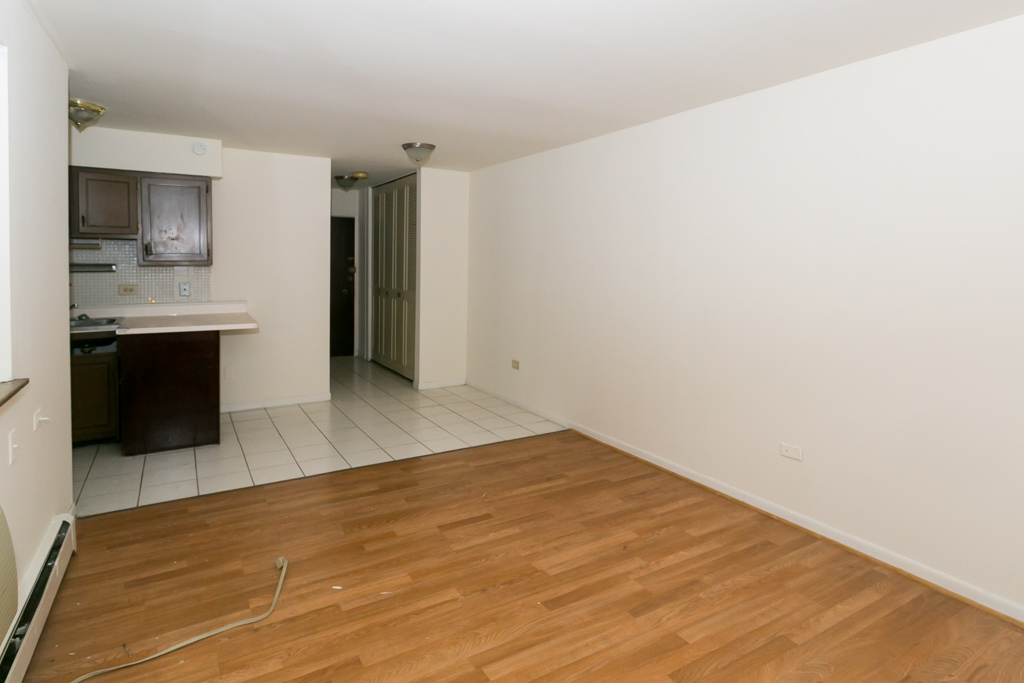 2629 North Hampden Court, Unit 216 Chicago, IL 60614 - Photo 11 of 14 a view of a kitchen with a sink and a refrigerator