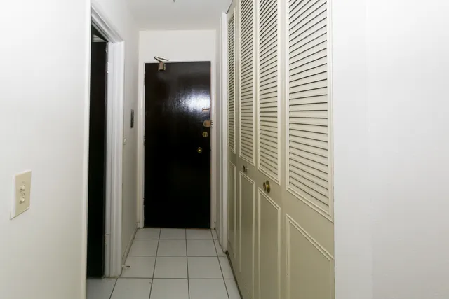 a white toilet sitting next to a bath tub