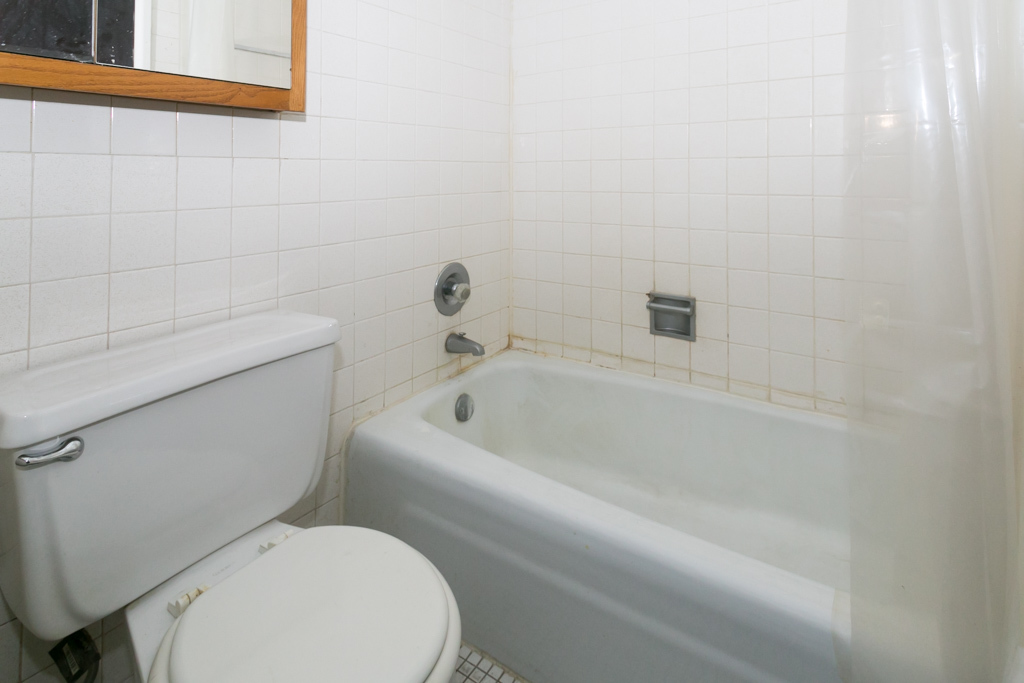 2629 North Hampden Court, Unit 216 Chicago, IL 60614 - Photo 13 of 14 a white toilet sitting next to a bath tub