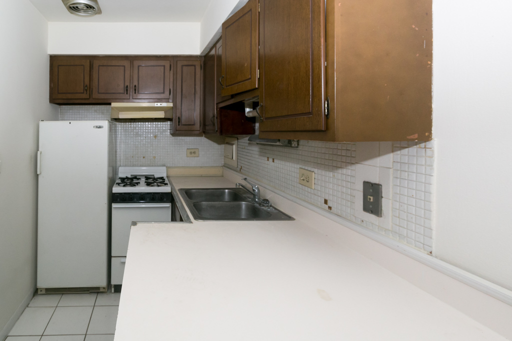 2629 North Hampden Court, Unit 216 Chicago, IL 60614 - Photo 2 of 14 a kitchen with a sink a stove and microwave