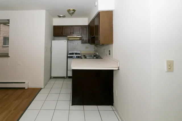 a kitchen with a sink and a stove top oven