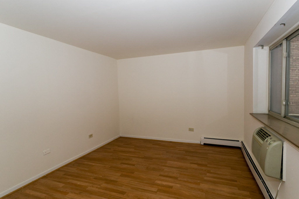 2629 North Hampden Court, Unit 216 Chicago, IL 60614 - Photo 8 of 14 a view of a room with wooden floor and a window