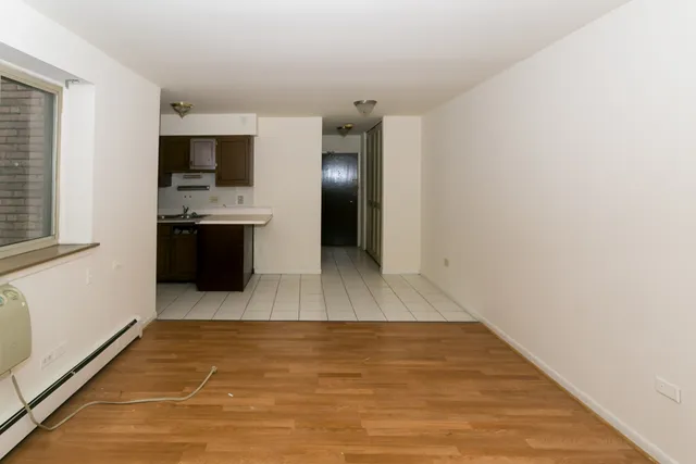 a view interior of a house and kitchen with stainless steel appliances
