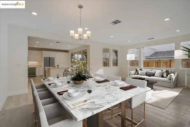 a large white kitchen with a sink and cabinets